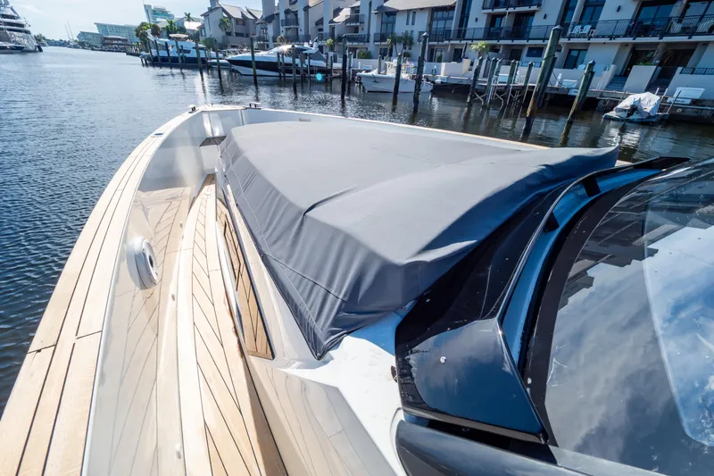  Yacht Photos Pics 2020 Fjord 44 Open yacht docked, featuring sleek design and covered deck area.