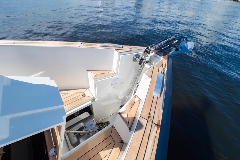  Yacht Photos Pics 2020 Fjord 44 Open yacht with anchor and teak deck on calm water.