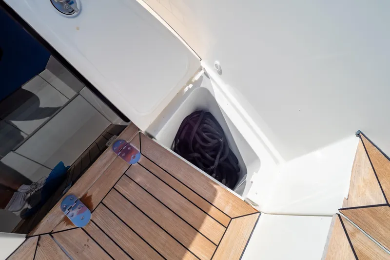  Yacht Photos Pics Storage compartment on 2020 Fjord 44 Open yacht with coiled rope.