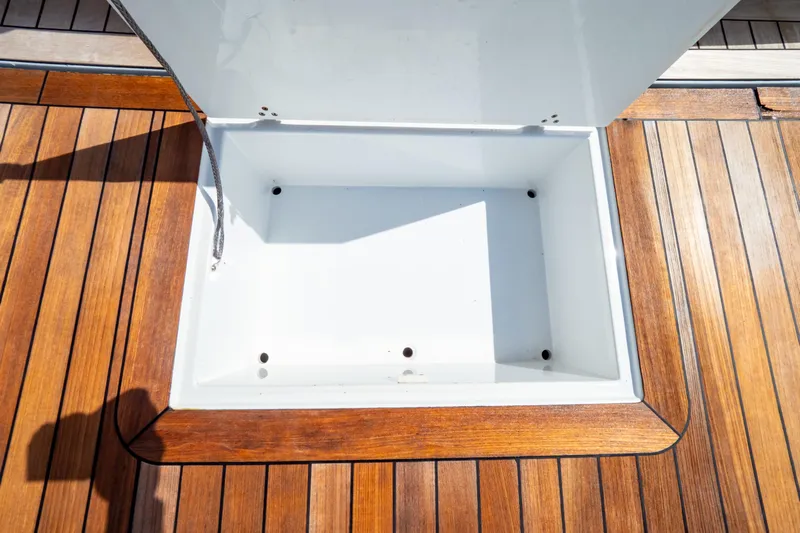  Yacht Photos Pics Open storage compartment on 2020 Fjord 44 Open yacht with wooden deck.