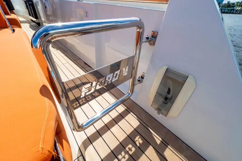  Yacht Photos Pics Fjord 44 Open 2020 yacht deck with orange seating and chrome details.