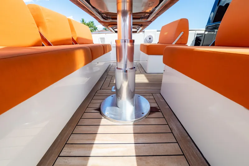  Yacht Photos Pics Interior of 2020 Fjord 44 Open yacht with orange seating and wooden flooring.