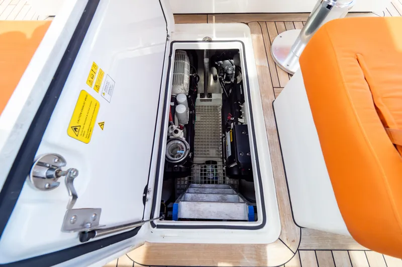  Yacht Photos Pics Engine compartment of 2020 Fjord 44 Open yacht with orange seating and wooden deck.