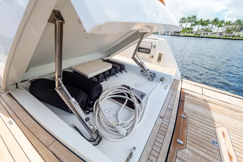  Yacht Photos Pics Open storage compartment on 2020 Fjord 44 Open yacht, docked by the water.
