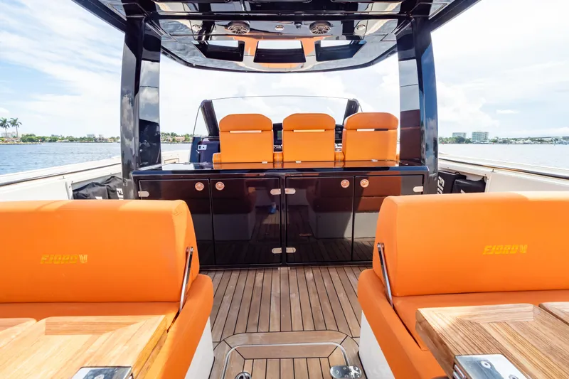 Yacht Photos Pics Luxurious 2020 Fjord 44 Open yacht interior with vibrant orange seating and sleek design.