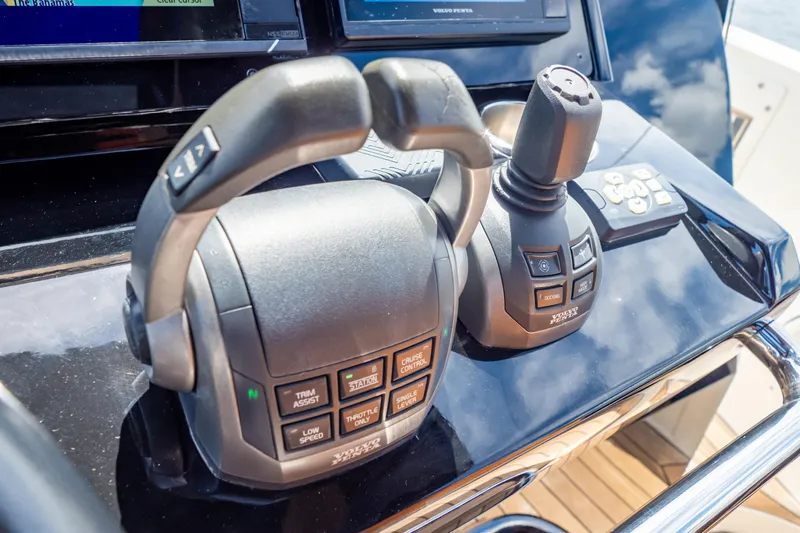  Yacht Photos Pics Close-up of 2020 Fjord 44 Open boat controls with joystick and throttle levers.