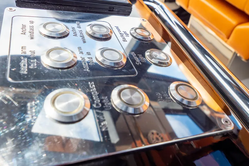  Yacht Photos Pics Control panel of a 2020 Fjord 44 Open yacht with metallic buttons and labels.
