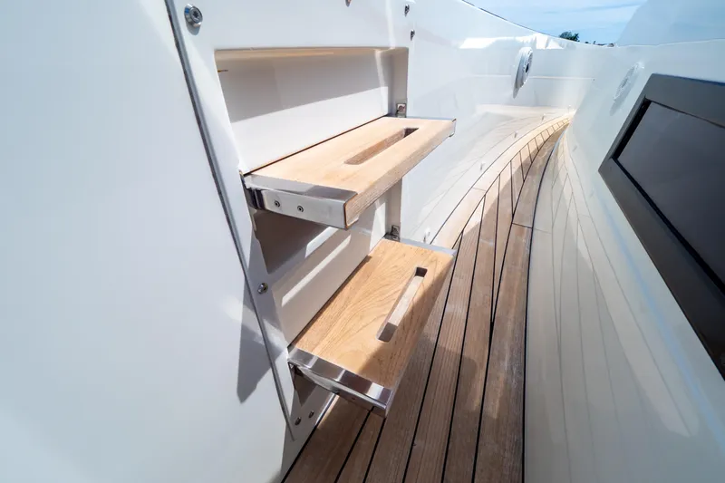  Yacht Photos Pics Luxury yacht Fjord 44 Open 2020 with sleek wooden deck and foldable steps.