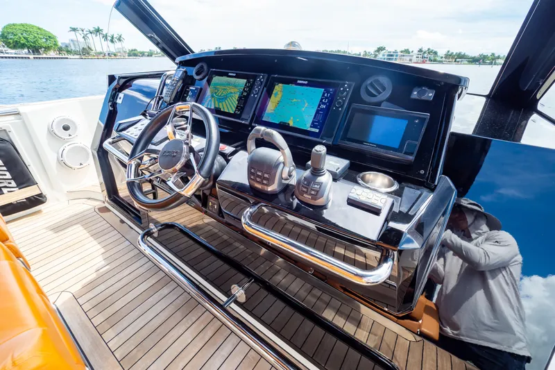  Yacht Photos Pics Helm of 2020 Fjord 44 Open yacht with advanced navigation systems and sleek design.