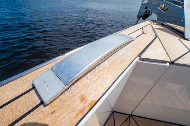  Yacht Photos Pics Fjord 44 Open 2020 yacht deck detail with sleek wood finish and metal accents.