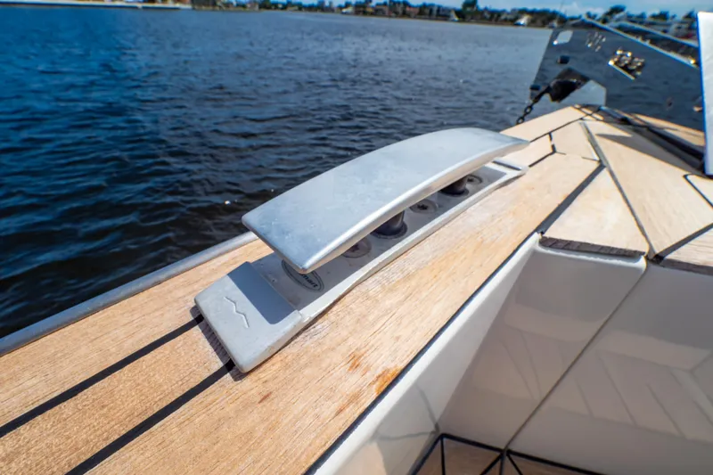  Yacht Photos Pics 2020 Fjord 44 Open yacht deck detail with cleat, overlooking calm water.