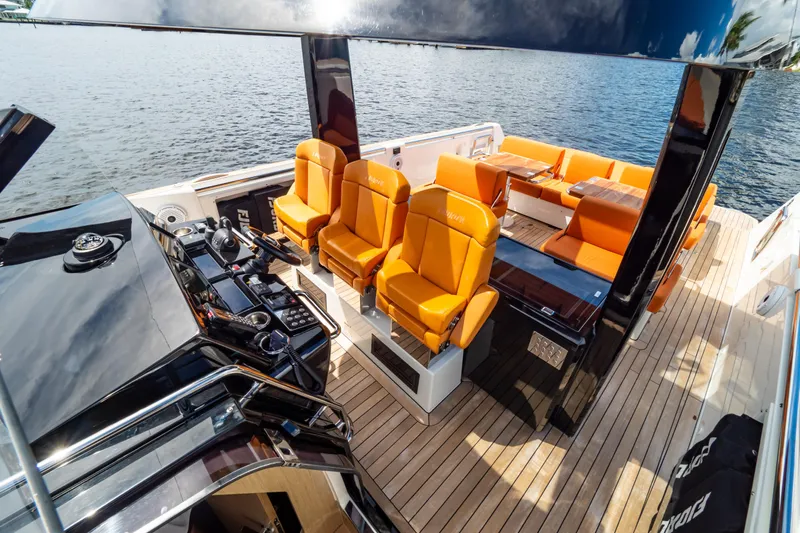  Yacht Photos Pics Luxurious 2020 Fjord 44 Open yacht with orange seating and sleek design on the water.