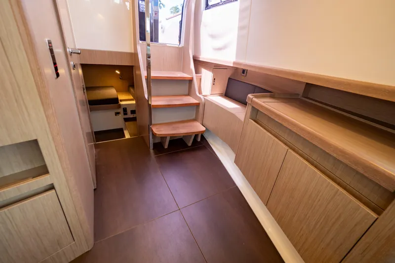  Yacht Photos Pics Interior of 2020 Fjord 44 Open yacht with wooden cabinetry and stairs.