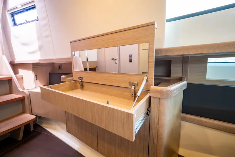  Yacht Photos Pics Interior of 2020 Fjord 44 Open yacht with wooden cabinetry and mirror.