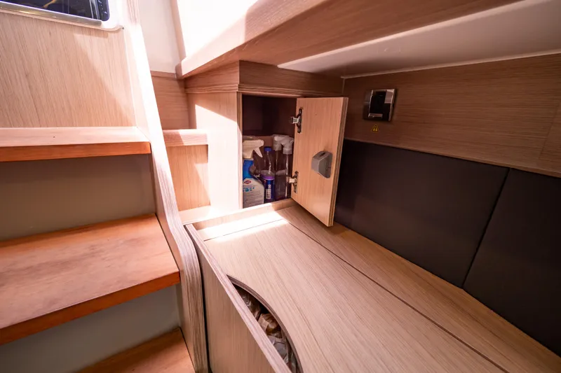  Yacht Photos Pics Interior of 2020 Fjord 44 Open yacht with wooden cabinetry and storage space.