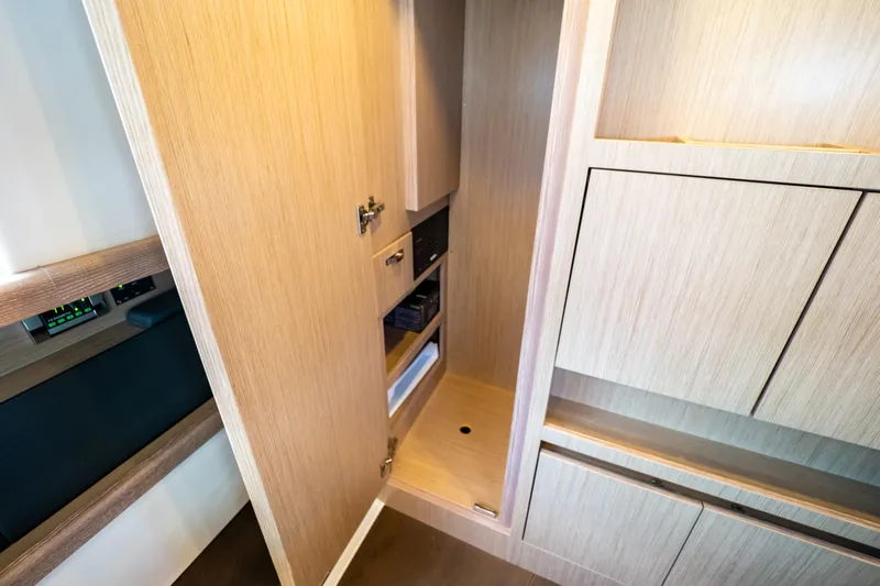  Yacht Photos Pics Interior view of 2020 Fjord 44 Open yacht, featuring sleek wooden cabinetry.
