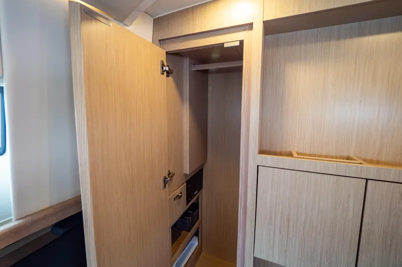  Yacht Photos Pics Wooden interior storage cabinet on a 2020 Fjord 44 Open yacht.