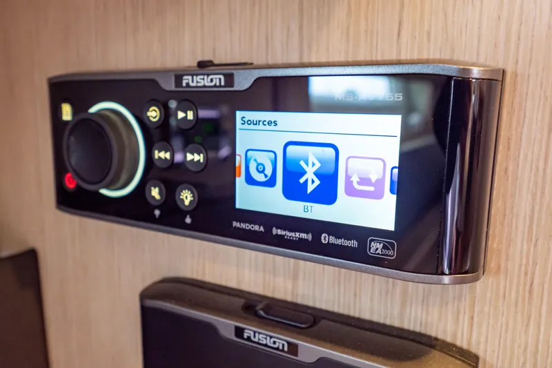  Yacht Photos Pics Fusion marine stereo system on 2020 Fjord 44 Open yacht, displaying Bluetooth connectivity.