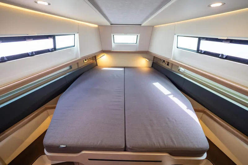  Yacht Photos Pics Luxurious cabin interior of 2020 Fjord 44 Open yacht with modern bedding.