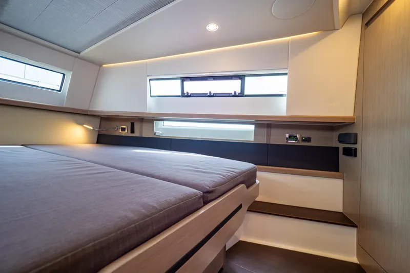  Yacht Photos Pics Interior cabin of 2020 Fjord 44 Open yacht, featuring modern design and comfortable bedding.
