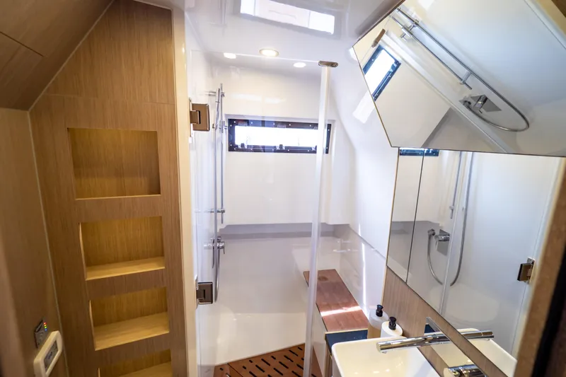  Yacht Photos Pics Modern bathroom interior of 2020 Fjord 44 Open yacht with sleek design and wooden accents.