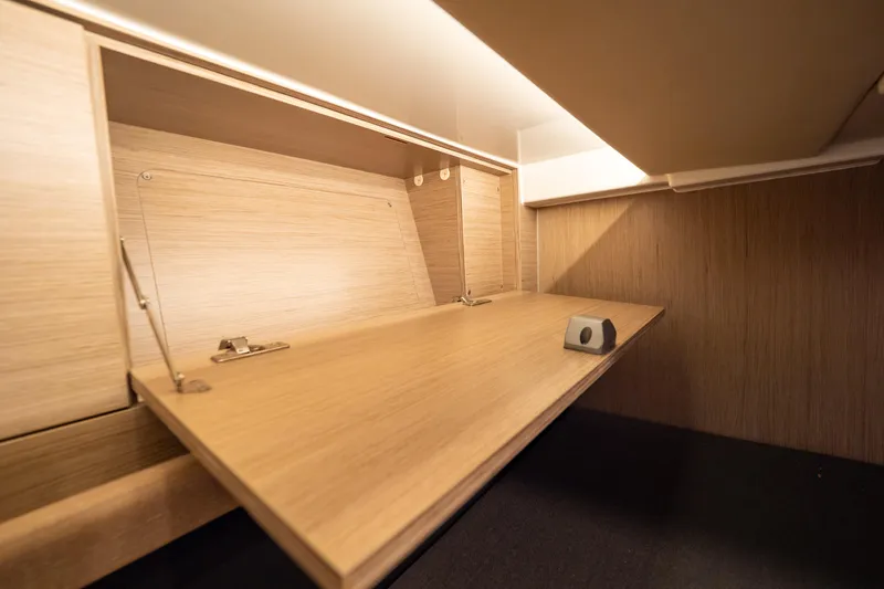  Yacht Photos Pics Interior of 2020 Fjord 44 Open yacht, featuring a wooden fold-out desk.