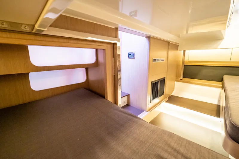  Yacht Photos Pics Interior of 2020 Fjord 44 Open yacht, featuring modern wood finishes and ambient lighting.