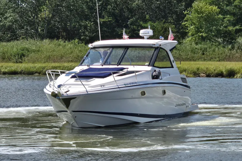  Yacht Photos Pics 2018 Regal 35 Sport Coupe cruising on a scenic river.