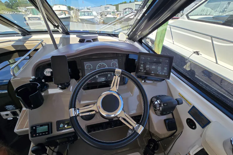  Yacht Photos Pics 2018 Regal 35 Sport Coupe helm with modern controls and navigation displays.