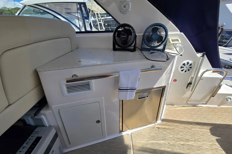  Yacht Photos Pics 2018 Regal 35 Sport Coupe interior with countertop, fans, and storage.