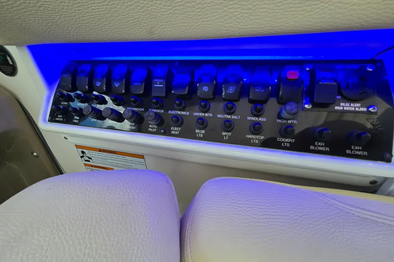 Yacht Photos Pics Control panel of a 2018 Regal 35 Sport Coupe with illuminated switches and labels.