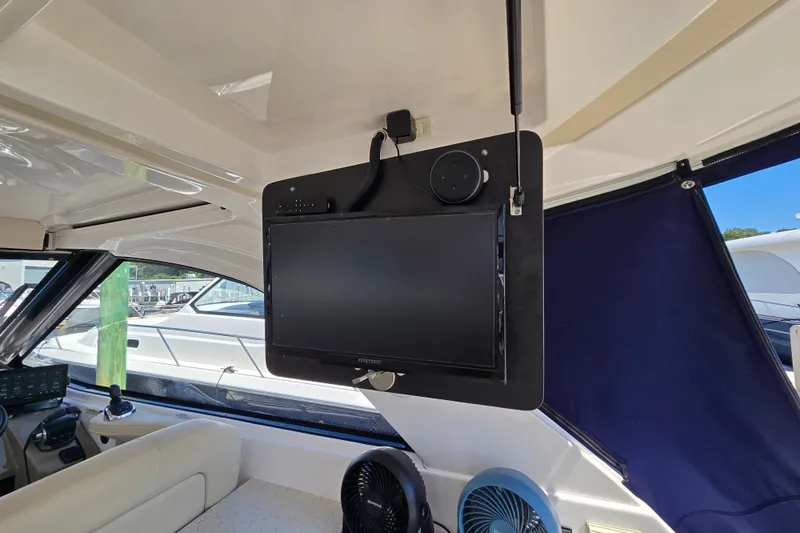  Yacht Photos Pics Interior of 2018 Regal 35 Sport Coupe with mounted TV and fan.