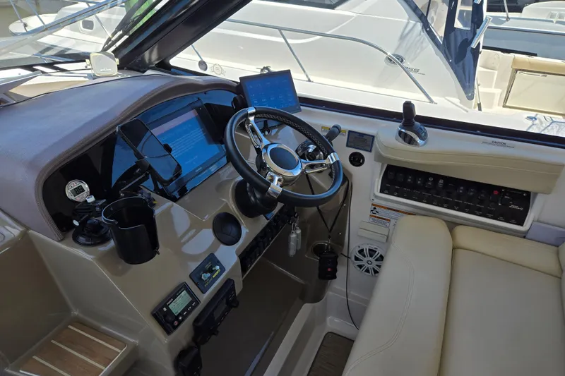  Yacht Photos Pics 2018 Regal 35 Sport Coupe helm with modern controls and navigation systems.