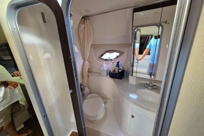  Yacht Photos Pics Bathroom interior of 2018 Regal 35 Sport Coupe with sink, toilet, and mirror.