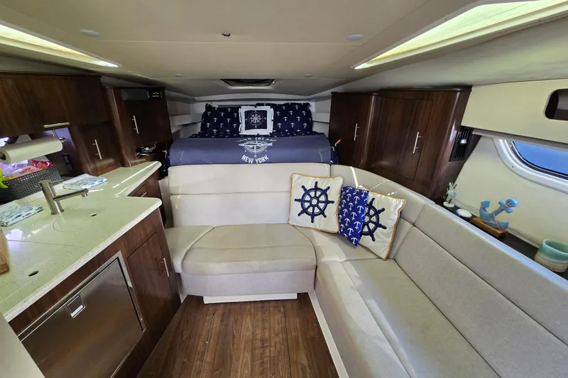  Yacht Photos Pics Interior of 2018 Regal 35 Sport Coupe with cozy seating and nautical decor.
