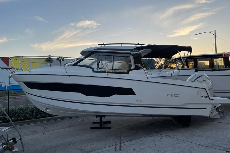  Yacht Photos Pics 2026 Jeanneau NC 795 Series 2 boat, sleek design, docked at sunset.