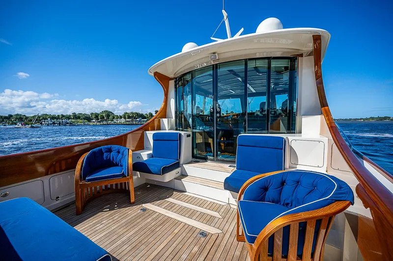 Hooligan VI Yacht Photos Pics Luxurious 2005 Hinckley Talaria 55 MY yacht with elegant seating and scenic ocean view.