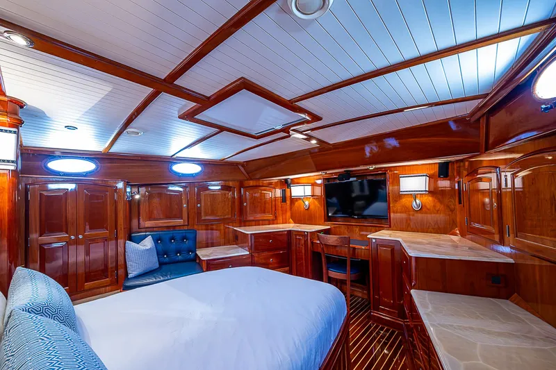 Hooligan VI Yacht Photos Pics Luxurious 2005 Hinckley Talaria 55 MY yacht cabin with elegant wood finish and modern amenities.