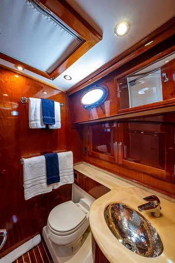 Hooligan VI Yacht Photos Pics Luxurious 2005 Hinckley Talaria 55 MY yacht bathroom with wood accents and modern fixtures.