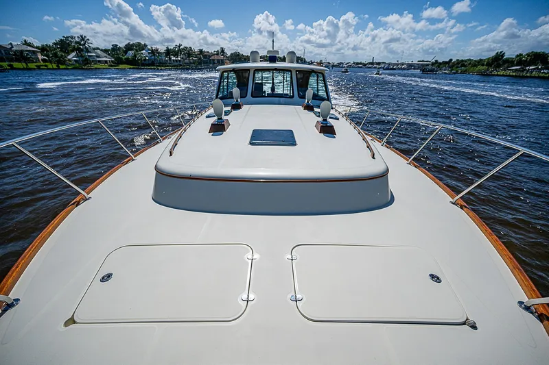 Hooligan VI Yacht Photos Pics 2005 Hinckley Talaria 55 MY yacht cruising on a sunny day with clear skies.