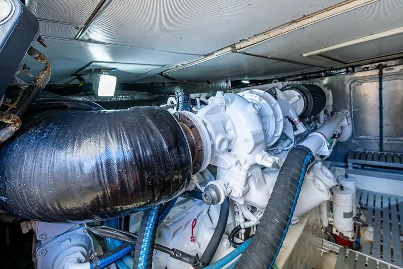 Hooligan VI Yacht Photos Pics Engine room of 2005 Hinckley Talaria 55 MY yacht, showcasing mechanical components and piping.