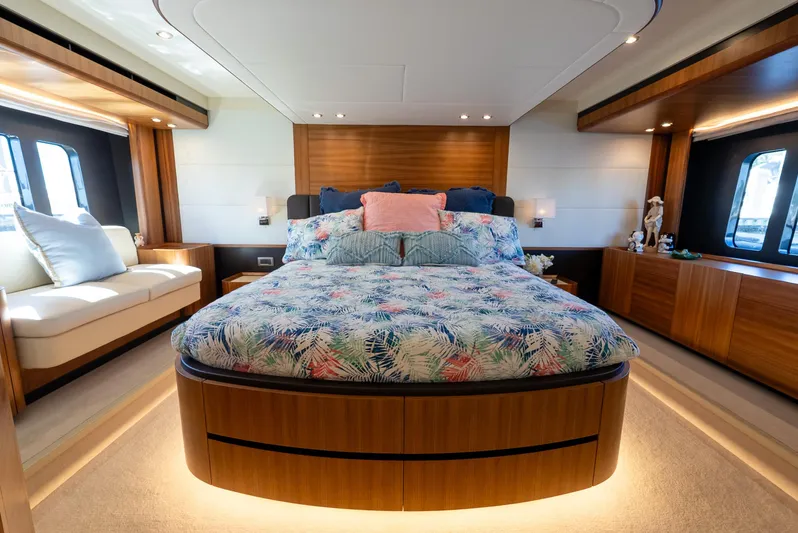 Just Joanne Yacht Photos Pics Luxurious bedroom interior on 2019 Absolute NAVETTA 58 yacht, featuring elegant wood finishes.