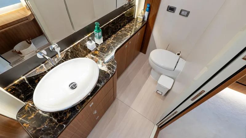 Just Joanne Yacht Photos Pics Luxurious bathroom in 2019 Absolute NAVETTA 58 yacht with marble countertop and modern fixtures.