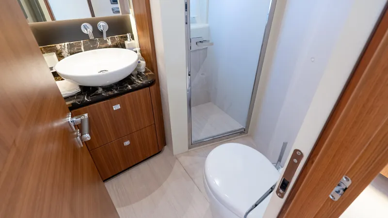 Just Joanne Yacht Photos Pics Luxurious bathroom in 2019 Absolute NAVETTA 58 yacht with modern fixtures and elegant design.