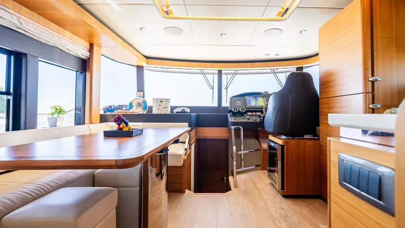 Just Joanne Yacht Photos Pics Luxurious interior of 2019 Absolute NAVETTA 58 yacht with modern furnishings and helm station.