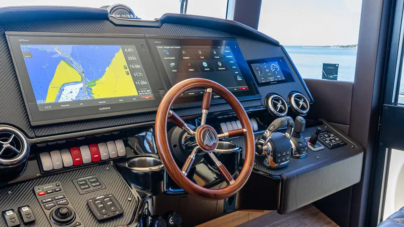 Just Joanne Yacht Photos Pics Helm of 2019 Absolute NAVETTA 58 yacht with navigation screens and controls.