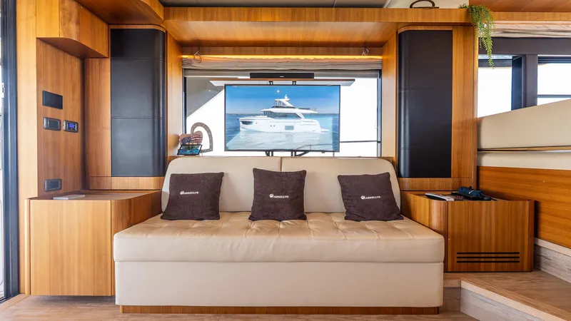 Just Joanne Yacht Photos Pics Luxurious interior of 2019 Absolute NAVETTA 58 yacht with elegant seating and modern decor.