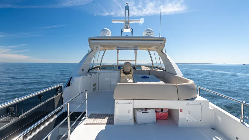 Just Joanne Yacht Photos Pics Luxurious 2019 Absolute NAVETTA 58 yacht deck with ocean view and clear blue sky.