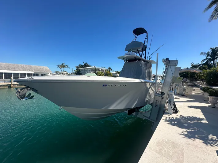  Yacht Photos Pics 2024 SeaVee 322z boat docked in a sunny marina setting.