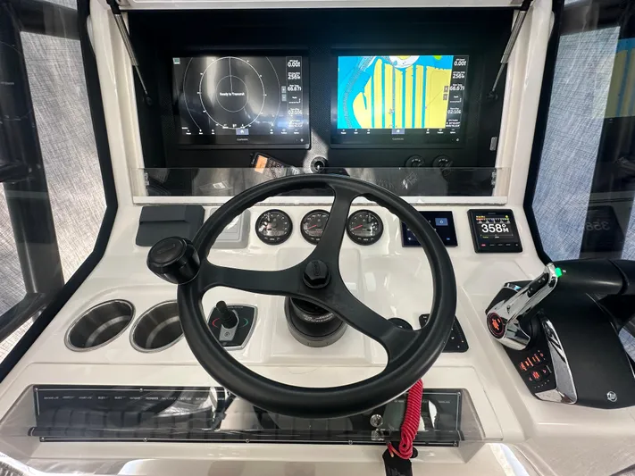  Yacht Photos Pics 2024 SeaVee 322z helm with advanced navigation displays and controls.